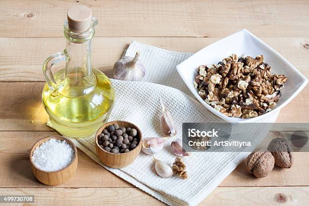 Walnuts In A White Bowl Garlic Pepper Salt And Oil Stock Photo - Download Image Now
