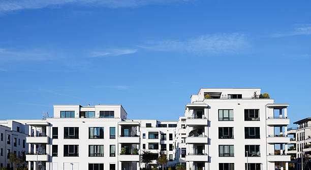 istock New white apartment houses and blue sky 499730802