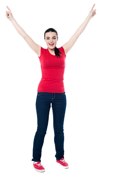 istock Joyous female raising arms in excitement 499736905