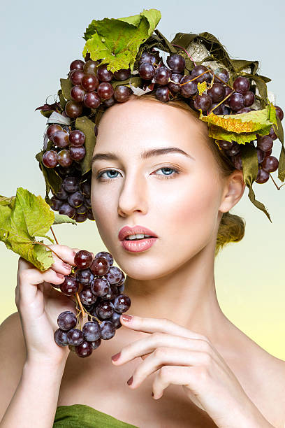 istock The girl with grapes 499738812
