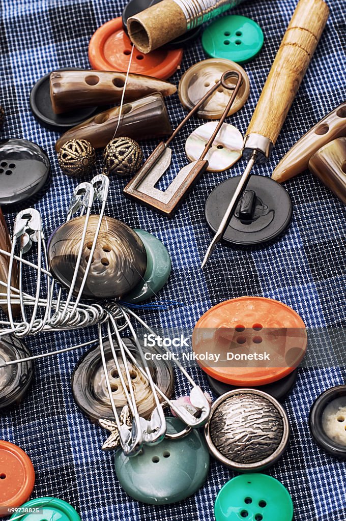 thread,button,crochet hook, and other sewing tools composition with sewing tools and decorations Art Stock Photo