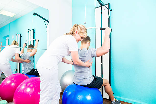 istock Physiotherapist doing sport rehabilitation with patient 499740132