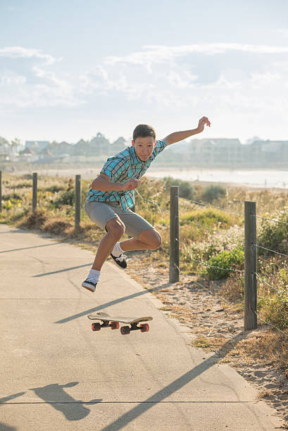 istock teenager jumping with skateboard 499740538