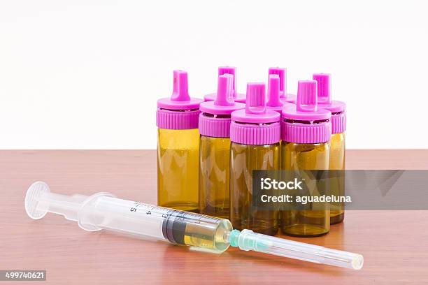 Syringe And Bottles Stock Photo - Download Image Now - Beauty Treatment, Biotechnology, Blue