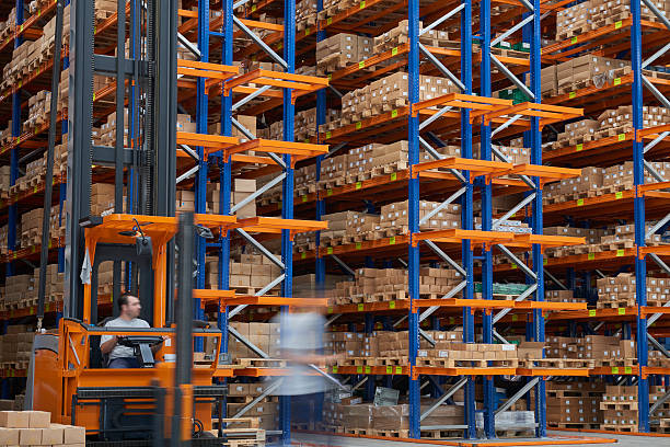 istock Cardboard boxes on shelves in warehouse 499740828