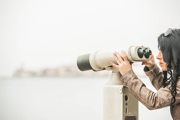 istock Woman Looking Through Tourist Coin-operated Binocular 499740834