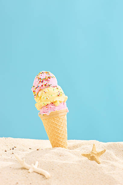 istock Ice cream sticking out of a sand 499740933
