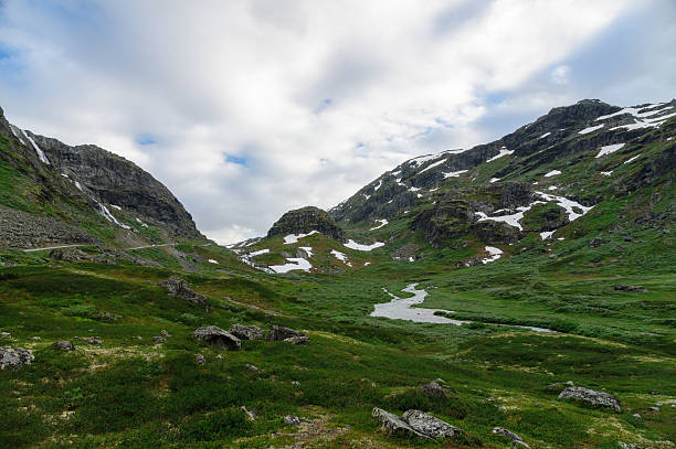 istock Picturesque valley between snowy rocks 499741130