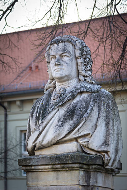 The composer Johann Sebastian Bach lived some years in the little town Koethen, Germany. A nineteenth-century monument to the composer stands outside the house where he lived 1719-23. The sculpture was designed by Heinrich Pohlmann in 1885. Bach was one of the most famous composer, organist, harpsichordist and violist in Germany. Bach lived from 21 March 1685 until 28 July 1750.