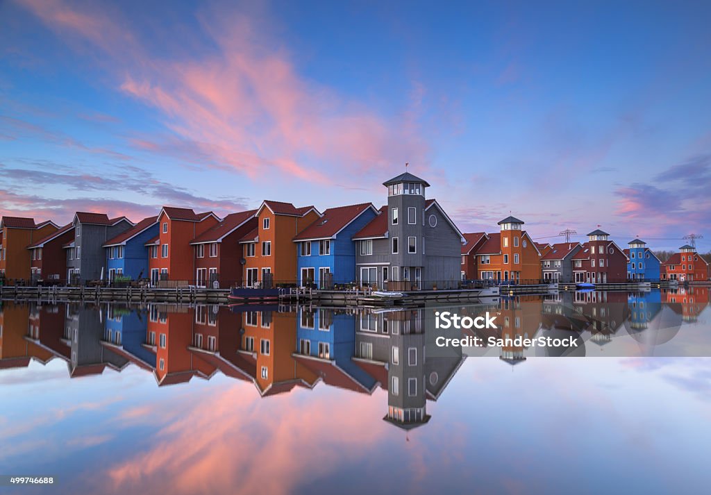 Dutch houses Living in wooden houses at the waterfront, Reitdiephaven, in Holland. House Stock Photo