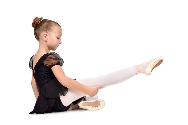 istock ballerina is sitting on the floor 499748612