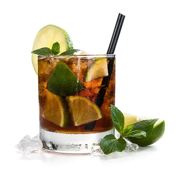 Cuba Libre Longdrink with brown rum and lime (isolated on white background)