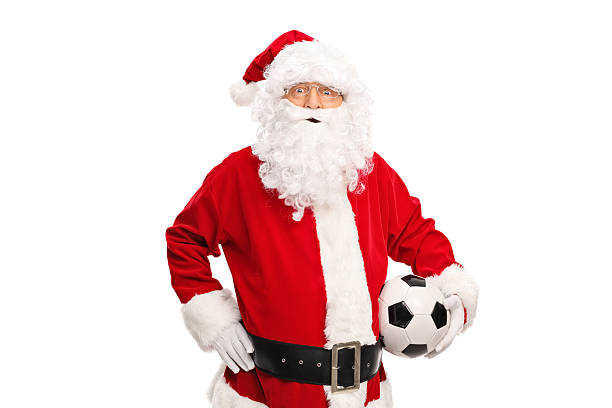 istock Santa Claus holding a soccer ball 499754070