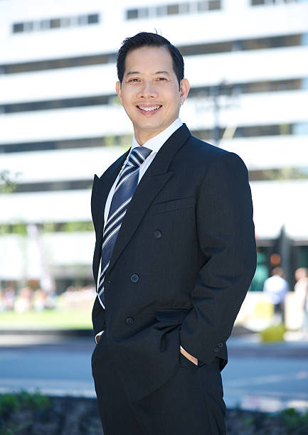 istock Cheerful businessman posing outside 499755269