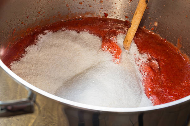 istock Strawberry jam cooking encore of sugar 499756231