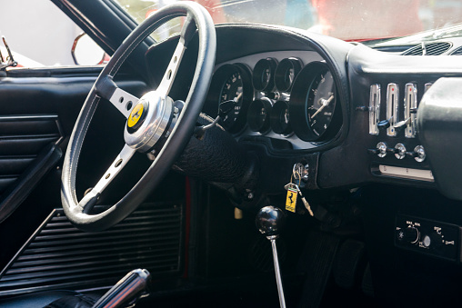 Zandvoort, The Netherlands - June 29, 2014: Black leather interior on a 1970s Ferrari 365 GTB Daytona classic sports car. The car is parked in the paddock during the Italia a Zandvoort event at the Zandvoort race track.
