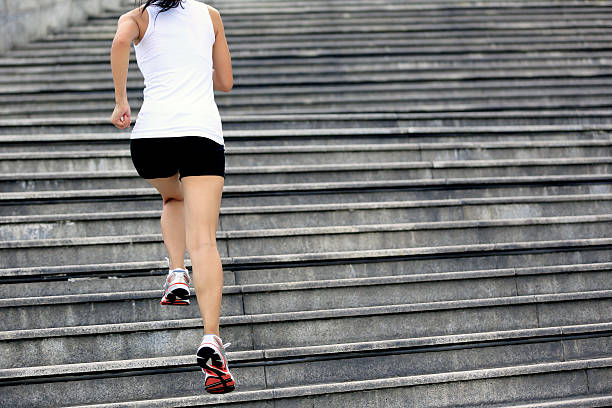 istock Runner athlete running on stairs. 499759591