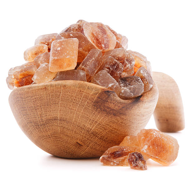 istock Brown cane caramelized lump sugar in wooden bowl 499761255