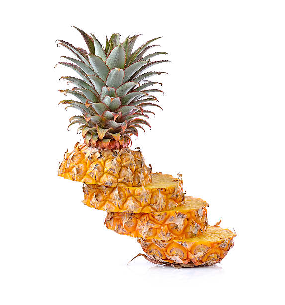 istock Juicy ripe sliced pineapple isolated on white background 499772702