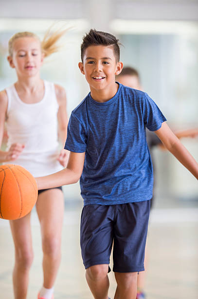 istock Dribbling the Ball Down the Court 499772838
