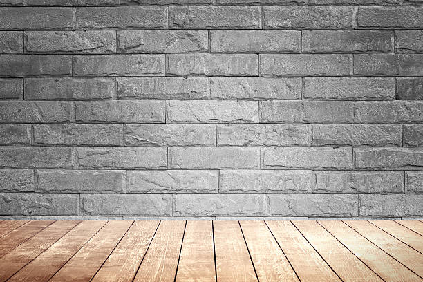 istock Blick brown wall background and wood shelf. 499773550