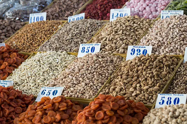 Osh bazaar in Kyrgyzstan - nuts and raisins for sale.