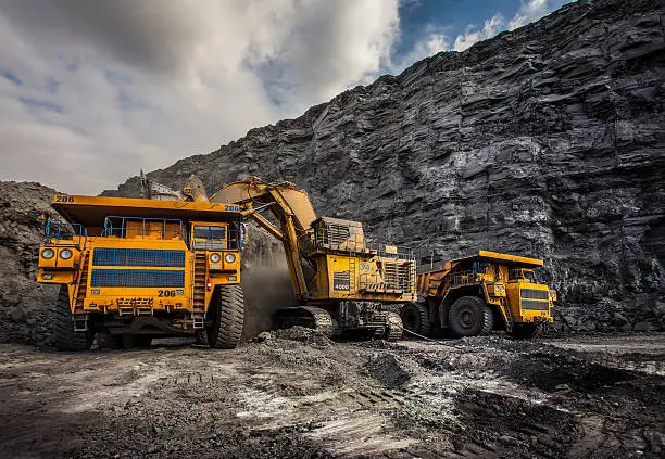 Coal production at one of the open fields in the south of Siberia. Dumpers "BelAZ". September 2015. 