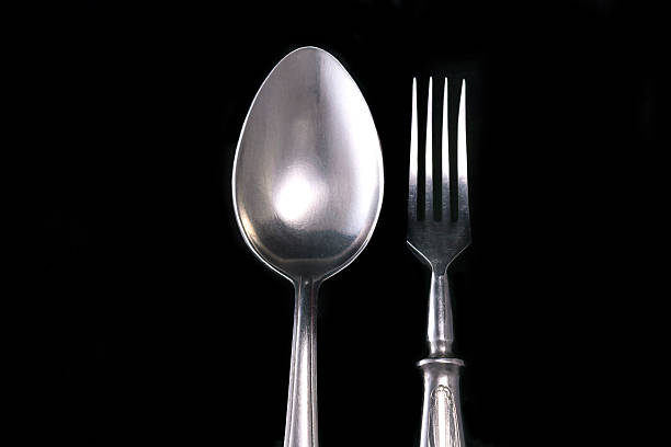 istock Spoon and fork on a black velvet 499776660
