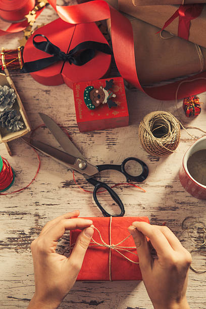 istock Top view of hands decorating a gift 499777720