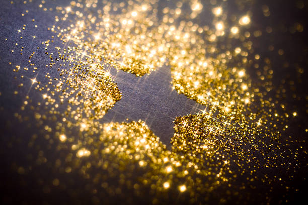 Macro photograhy of golden glitter.