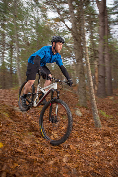 istock Mountain biker catching a bit of air on a trail. 499778840