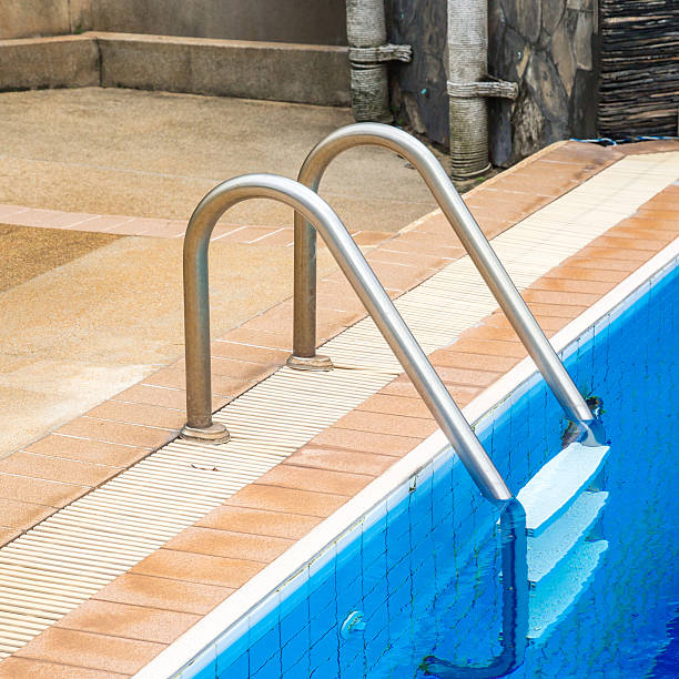 istock Swimming pool with stair at hotel. 499778990