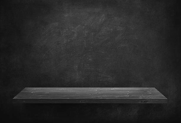 istock Black wooden plank on dark wall 499779876