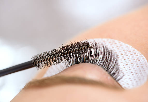 istock application of false eyelashes at spa salon 499780072