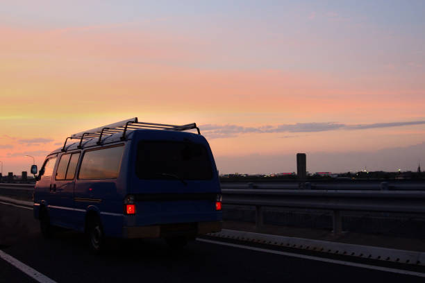 Drive into the sunset A van driving into the sunset. happy end stock pictures, royalty-free photos & images