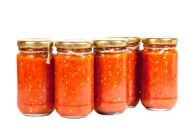 istock Bottles of Bright Red Chilli Preserve known as Mazavaroo 499780339