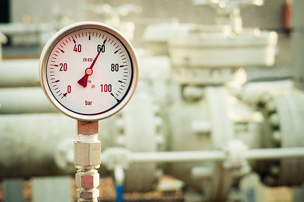 Manometer measuring high pressure natural gas closeup of a manometer measuring high pressure on a natural gas installation. gauge pressure gauge pipe valve stock pictures, royalty-free photos & images