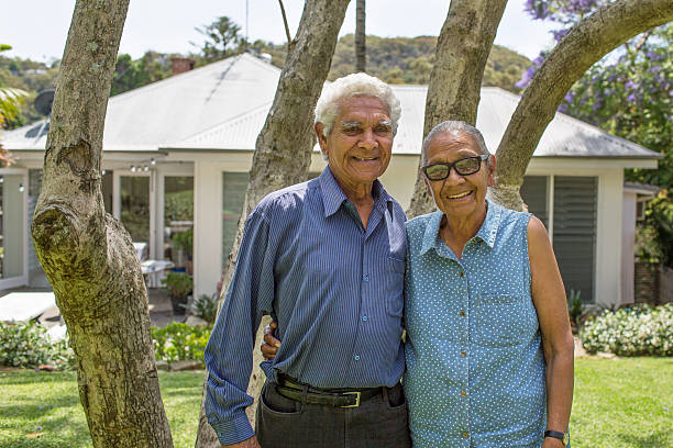 Australian seniors in their garden Aboriginal couple in garden australian aborigine culture stock pictures, royalty-free photos & images