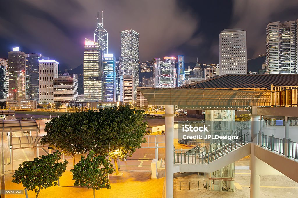 Hong Kong Skyline by Central Pier Hong Kong Skyline from Central Ferry Pier at Night Architecture Stock Photo