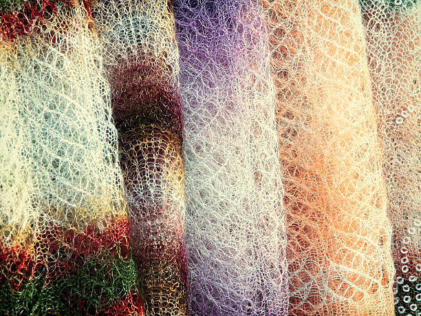 istock Wool shawls hanging for sale.Toned image. 499782194