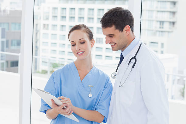 istock Smiling surgeon and doctor working together 499785827