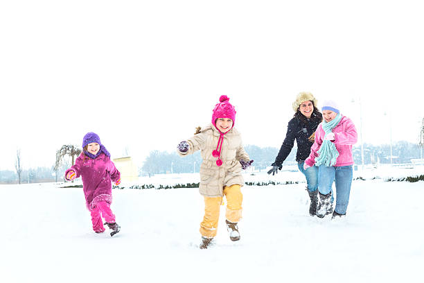 istock Cute family having fun in the snow 499798594