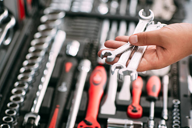 istock Worker at the store chooses wrench tools 499799024