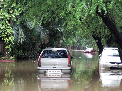 Mumbai, India - July 27, 2005: flooded cars on the streets during floods in india in 2005 in Mumbai