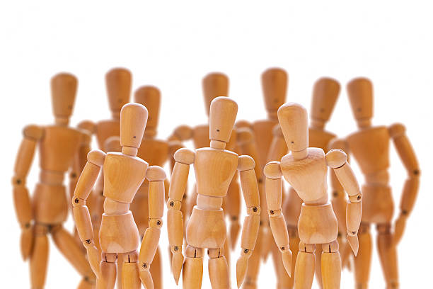 istock Group of wooden dummies 499804888