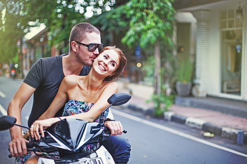 couple riding motorcycle