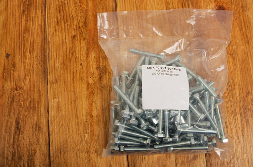 Plastic bag of plated bolts