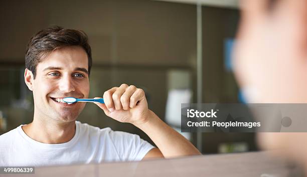 Keeping His Teeth Clean And Healthy Stock Photo - Download Image Now - Brushing Teeth, Men, Mirror - Object