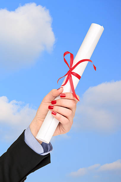 istock Woman holding a diploma 499806623