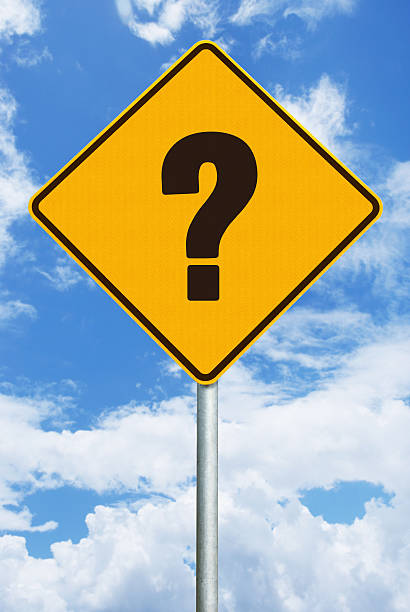 istock Question Mark  - Warning Sign Against Blue Sky with Clouds 499807851
